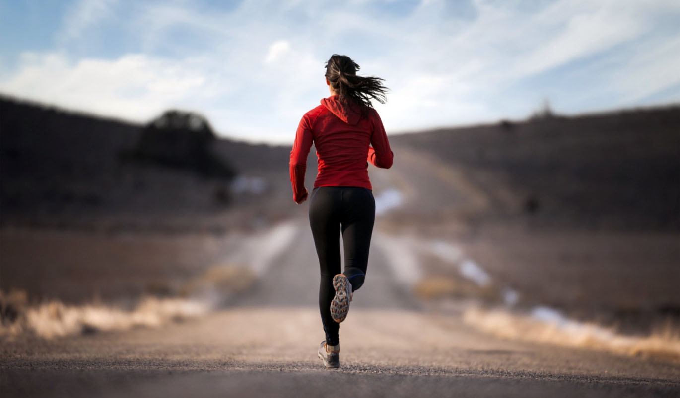 Woman jogging on road